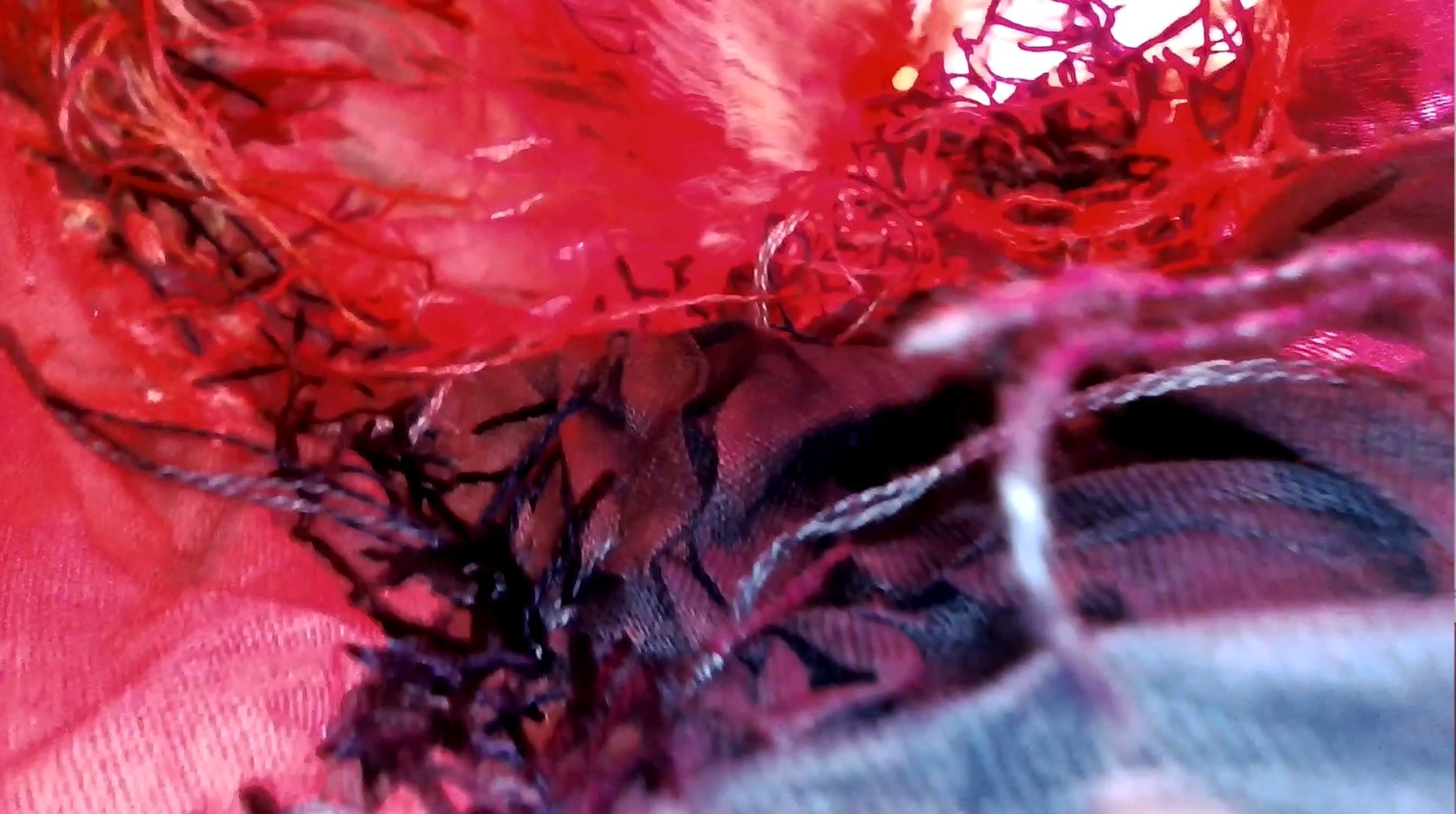 MA Fine Art work by Hannah Rae showing a video inside a textile sculpture filmed with an endoscope camera.