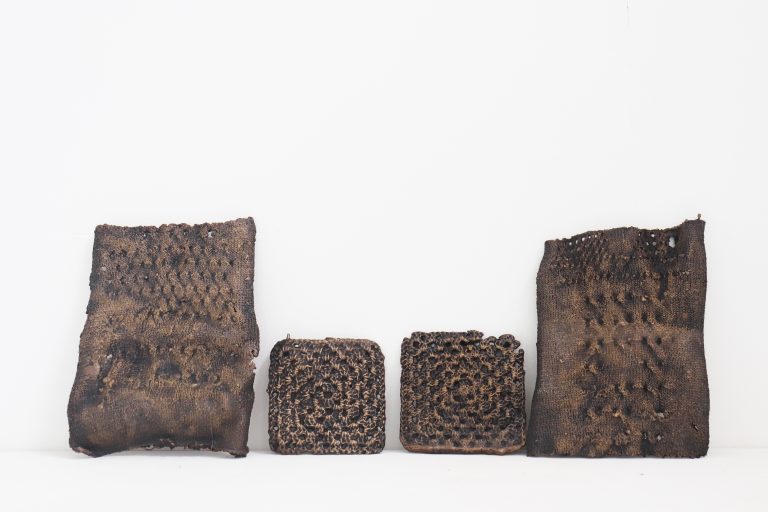 Four sculptures made of bronze. The texture resembles weaving and crochet, yet they are hard and cold. Despite their weight, they are small. The smaller pieces measure approximately 15x15cm, while the larger ones are about 18x30cm.