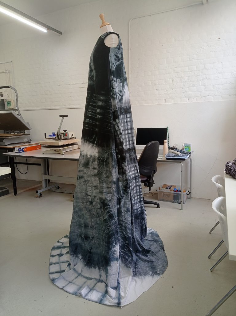 An enlarged garment made by Labani Biswas showing string sound patterns on garment.