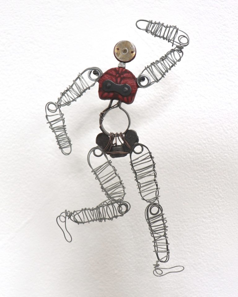Fine Art work by Scarlett Morley showing a small mixed media sculpture, made from clay, aluminium wire and found metal objects.