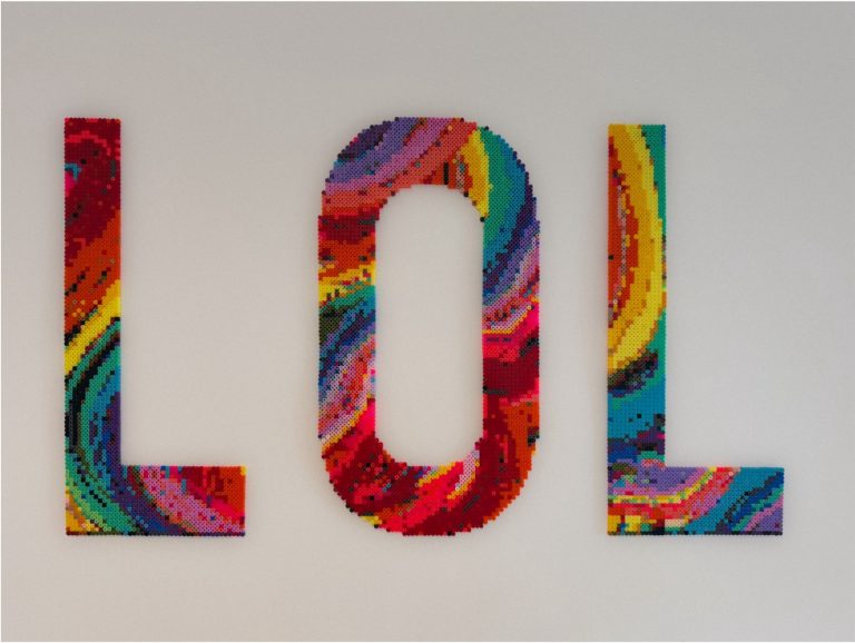 BA Fine Art work by Amber Cruse Earle that says LOL in rainbow colours made from Hama beads.