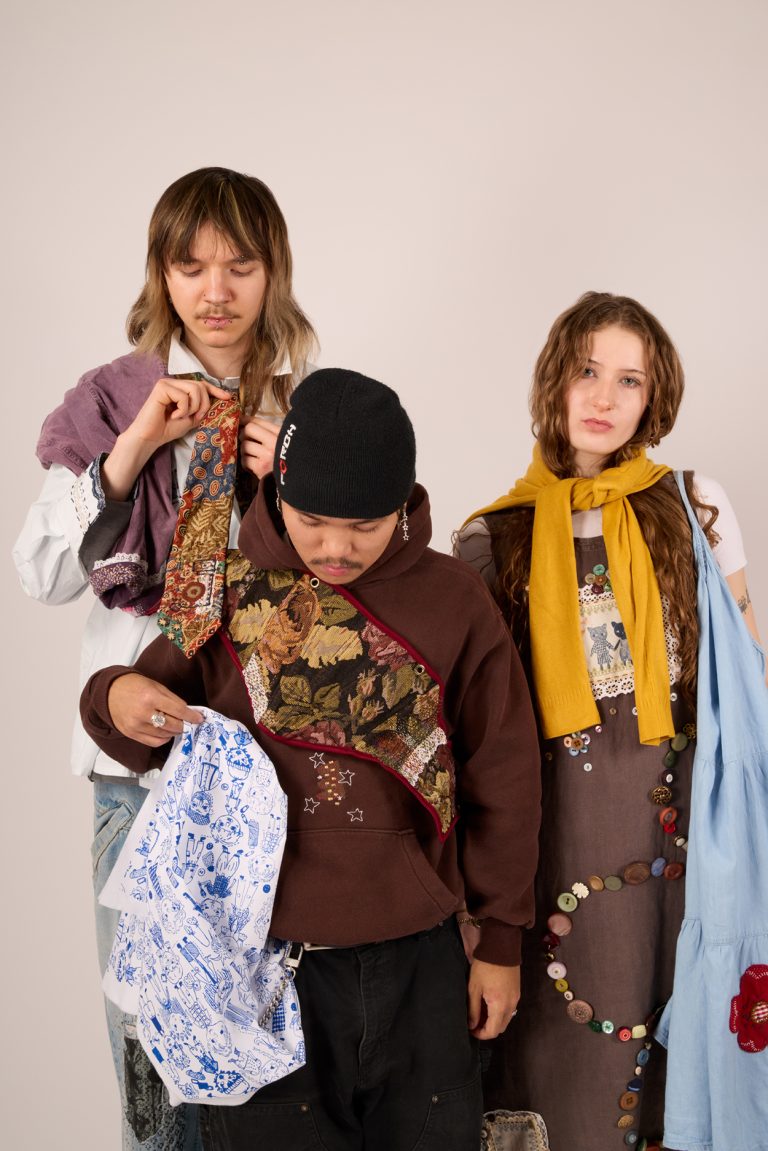 Professional photograph of models styled wearing repaired and up-cycled garments