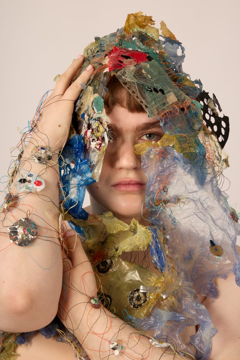 Mixed media textile garment by Samantha Carter-Boardley showing waste plastic embellished pieces