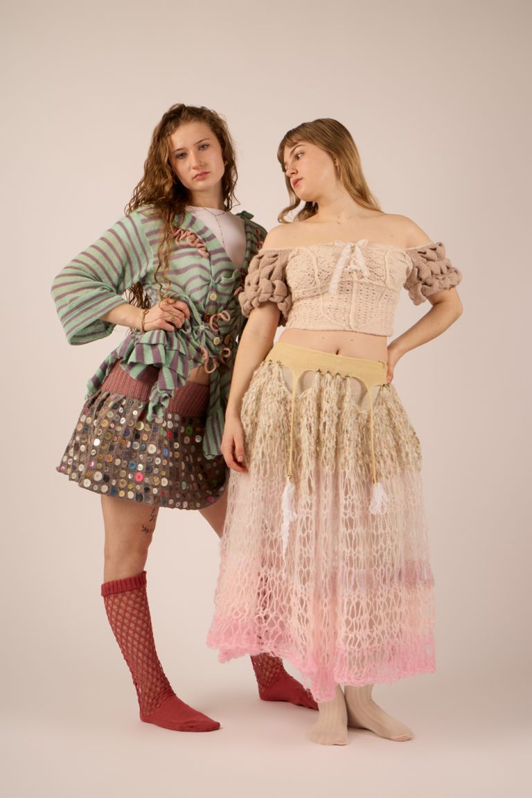 Knitted fashion collection by Sinead Burrage, featuring two models wearing colourful, playful garments